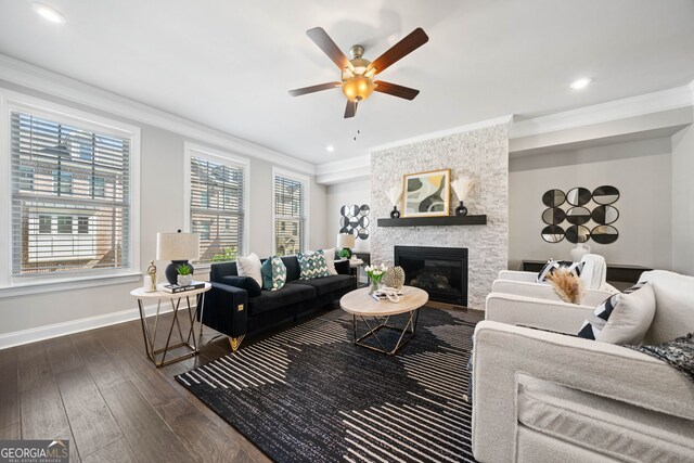 living area featuring crown molding, baseboards, a ceiling fan, and dark wood-style flooring