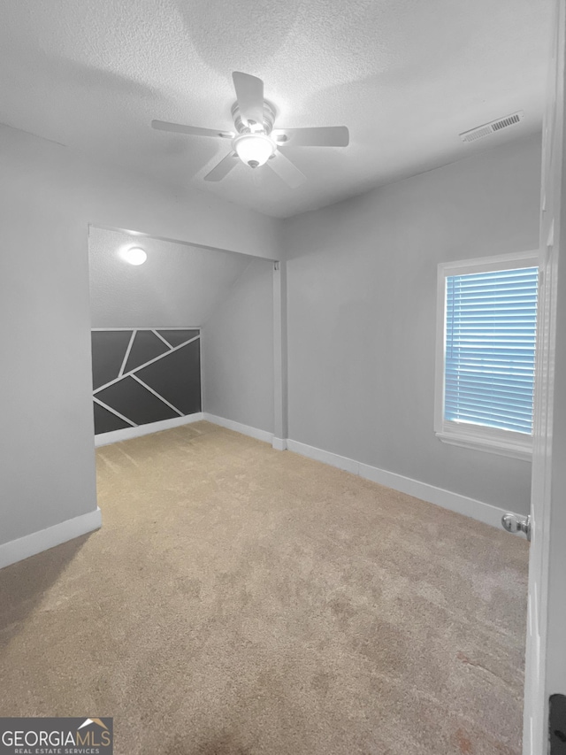100 Little Creek Dr, Sharpsburg, GA 30277 - spare room with ceiling fan, carpet flooring, a textured ceiling, and baseboards