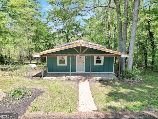 139 Cherokee Dr, Jackson, GA 30233 - view of front of home with board and batten siding and an outdoor structure