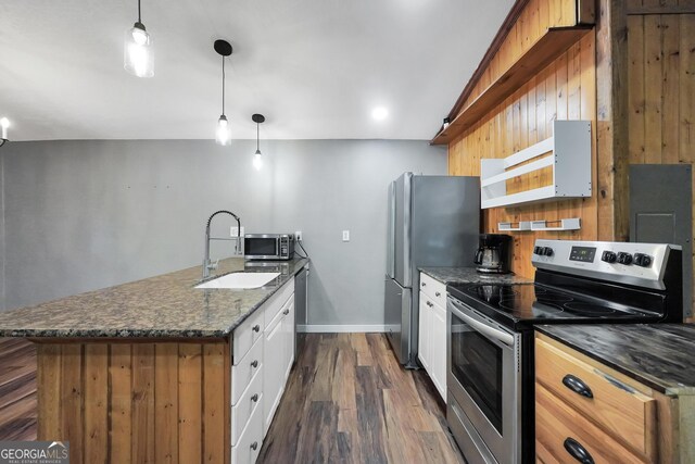 139 Cherokee Dr, Jackson, GA 30233 - kitchen with dark wood-style floors, white cabinets, under cabinet range hood, stainless steel appliances, and a sink