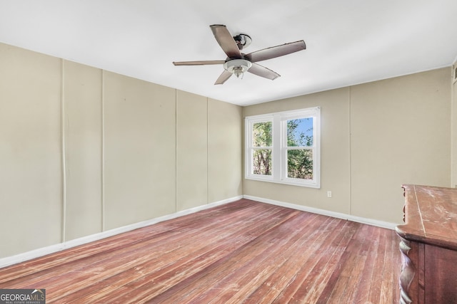139 Cherokee Dr, Jackson, GA 30233 - spare room featuring wood finished floors, baseboards, and a ceiling fan
