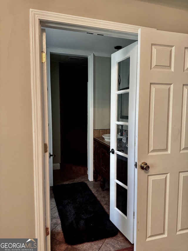 bathroom featuring tile patterned flooring