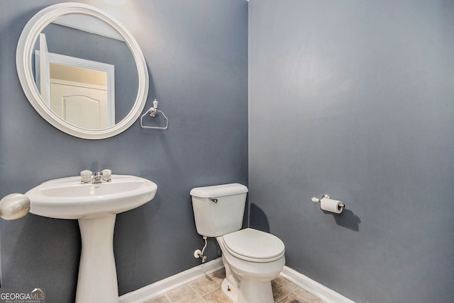 432 Tanner Farm Dr, Rockmart, GA 30153 - half bathroom featuring toilet, baseboards, and tile patterned flooring