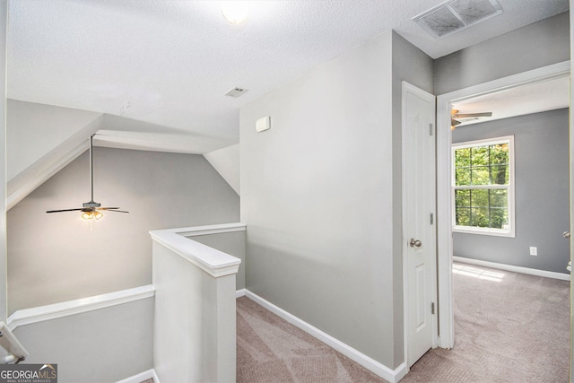 432 Tanner Farm Dr, Rockmart, GA 30153 - hall featuring an upstairs landing, carpet floors, baseboards, and a textured ceiling