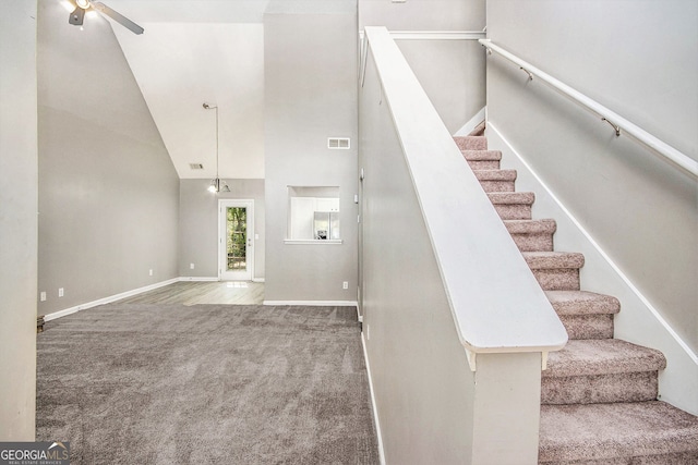 432 Tanner Farm Dr, Rockmart, GA 30153 - staircase featuring carpet flooring, high vaulted ceiling, ceiling fan, and baseboards