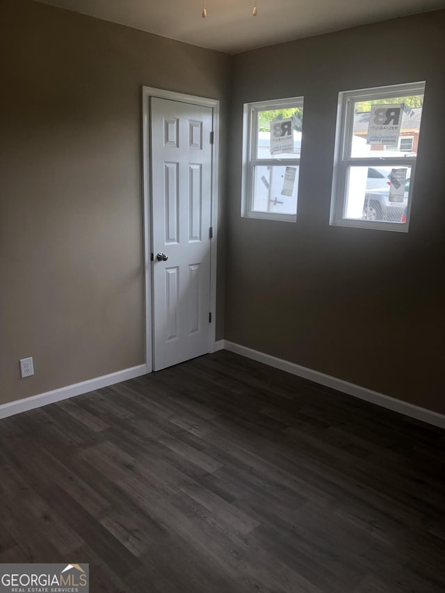 576 Pansy Ave, Macon, GA 31204 - empty room featuring dark wood-style flooring and baseboards