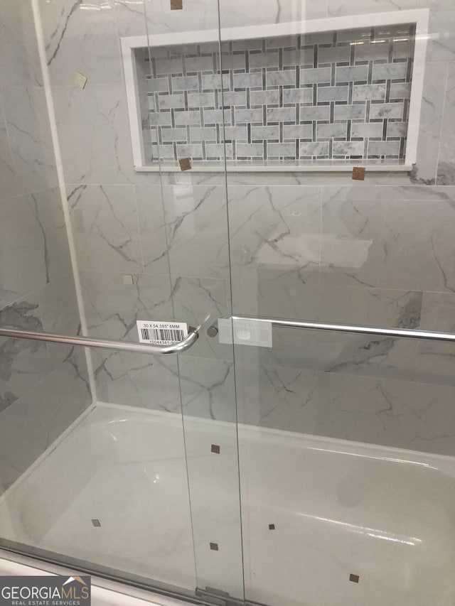 576 Pansy Ave, Macon, GA 31204 - full bathroom with a marble finish shower
