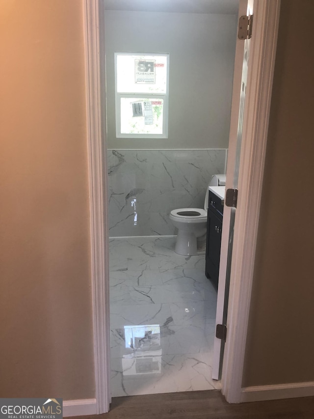 576 Pansy Ave, Macon, GA 31204 - bathroom featuring toilet, marble finish floor, and vanity