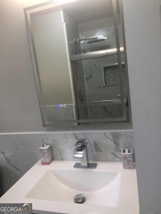 576 Pansy Ave, Macon, GA 31204 - bathroom with tasteful backsplash, an enclosed shower, and vanity
