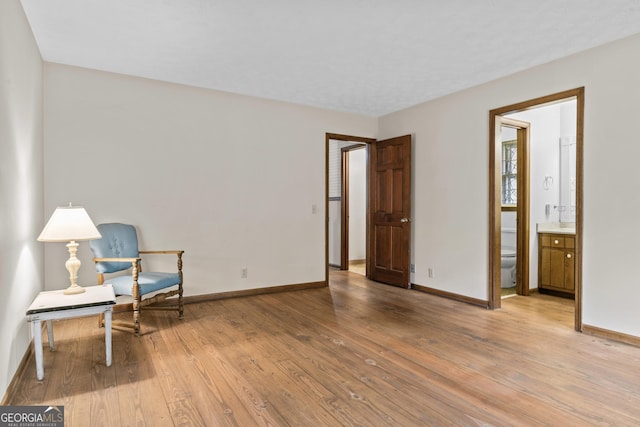 3588 SW Highridge Dr, Conyers, GA 30094 - living area with baseboards and light wood-style floors