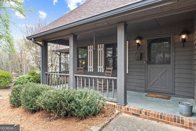 3588 SW Highridge Dr, Conyers, GA 30094 - doorway to property with a porch and a shingled roof