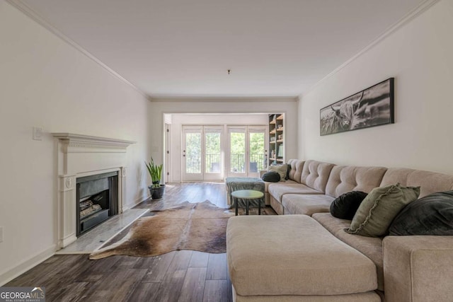 3203 Lenox Rd NE Unit 32, Atlanta, GA 30324 - living area featuring wood finished floors, crown molding, a high end fireplace, and baseboards