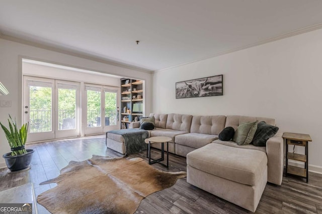 3203 Lenox Rd NE Unit 32, Atlanta, GA 30324 - living room featuring dark wood-style floors, ornamental molding, and baseboards