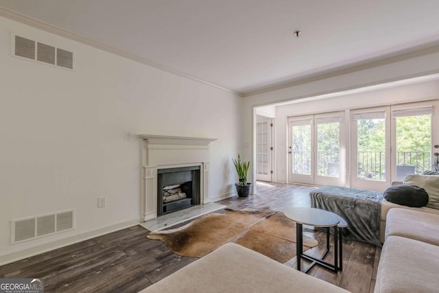 3203 Lenox Rd NE Unit 32, Atlanta, GA 30324 - living room with crown molding, wood finished floors, baseboards, and a fireplace with raised hearth