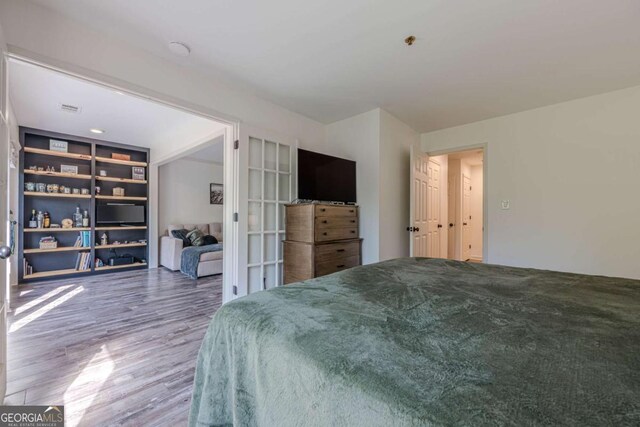 3203 Lenox Rd NE Unit 32, Atlanta, GA 30324 - bedroom featuring wood finished floors