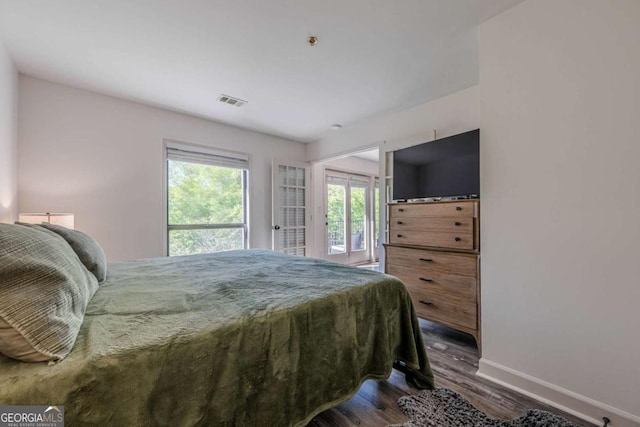 3203 Lenox Rd NE Unit 32, Atlanta, GA 30324 - bedroom with baseboards, dark wood-type flooring, and access to outside