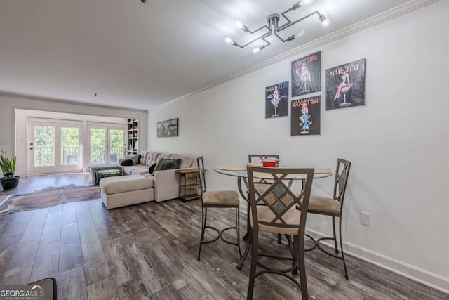 3203 Lenox Rd NE Unit 32, Atlanta, GA 30324 - dining space with crown molding, wood finished floors, and baseboards