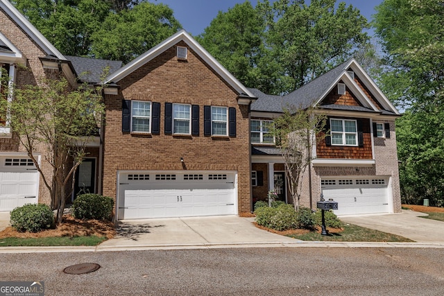 170 Elliot Cir, Watkinsville, GA 30677 - view of front of property featuring driveway, an attached garage, brick siding, and a shingled roof