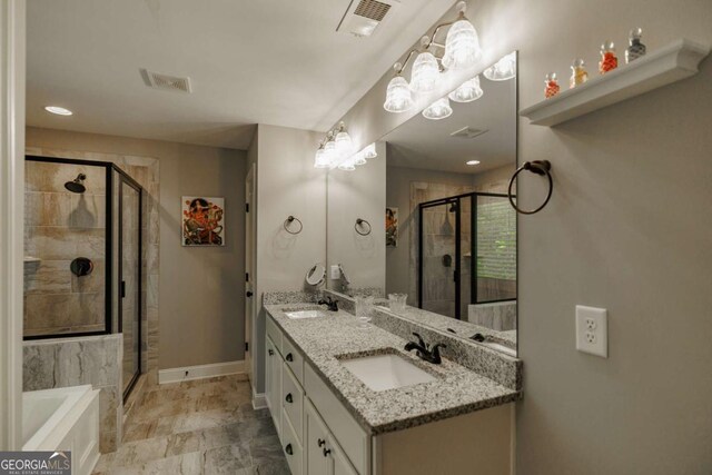 170 Elliot Cir, Watkinsville, GA 30677 - bathroom with a garden tub, double vanity, and a stall shower
