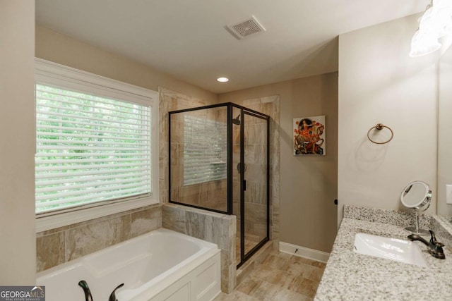 170 Elliot Cir, Watkinsville, GA 30677 - bathroom featuring a bath, a shower stall, and vanity