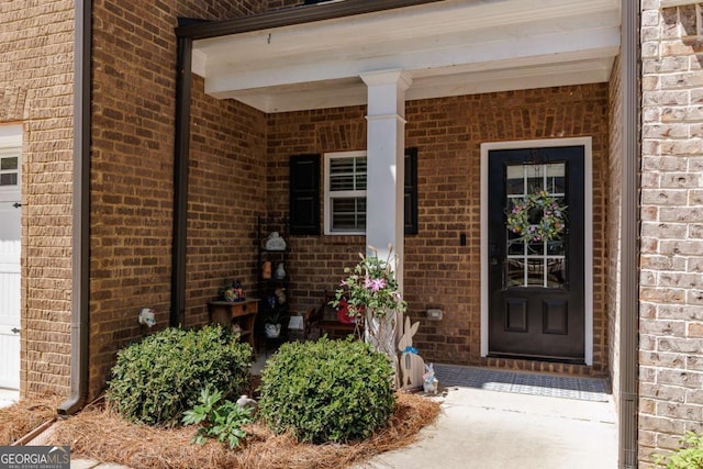 170 Elliot Cir, Watkinsville, GA 30677 - view of exterior entry with brick siding and a porch