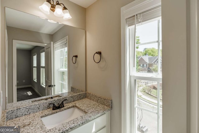 170 Elliot Cir, Watkinsville, GA 30677 - bathroom with vanity and a chandelier