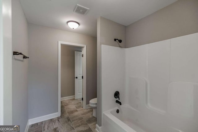 170 Elliot Cir, Watkinsville, GA 30677 - bathroom featuring toilet and tub / shower combination