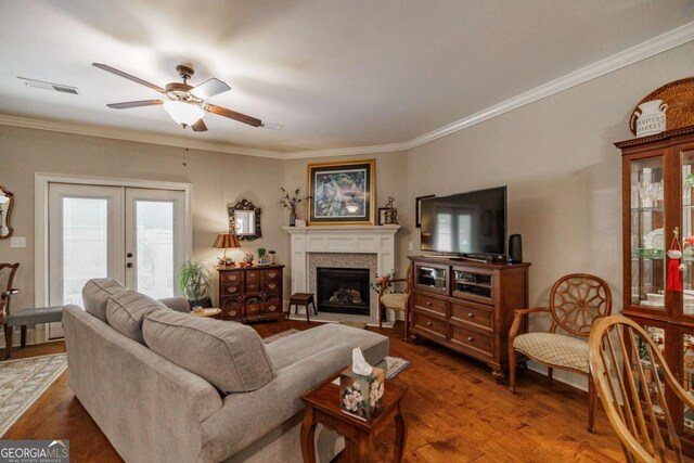 170 Elliot Cir, Watkinsville, GA 30677 - living area featuring a ceiling fan, french doors, crown molding, wood finished floors, and a fireplace