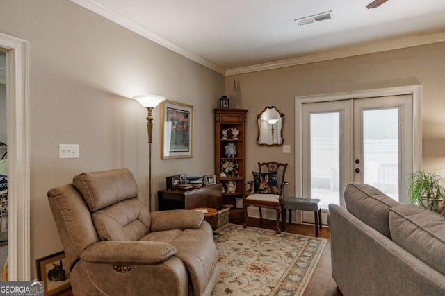 170 Elliot Cir, Watkinsville, GA 30677 - living room with french doors, light wood-style flooring, and crown molding