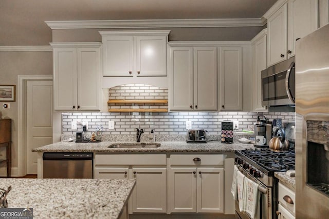 170 Elliot Cir, Watkinsville, GA 30677 - kitchen featuring appliances with stainless steel finishes, tasteful backsplash, white cabinets, light stone counters, and ornamental molding