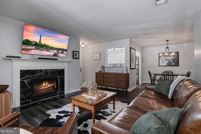 401 Berkeley Woods Dr, Duluth, GA 30096 - living room with a chandelier, wood finished floors, and a fireplace