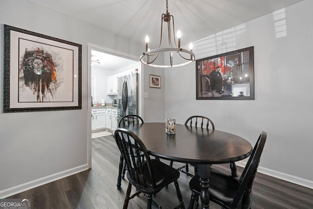 401 Berkeley Woods Dr, Duluth, GA 30096 - dining room with dark wood-style flooring and a chandelier