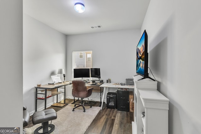 home office featuring visible vents and dark wood-style floors