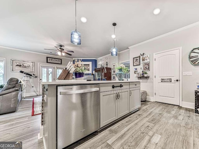 kitchen featuring open floor plan, crown molding, a healthy amount of sunlight, and dishwasher