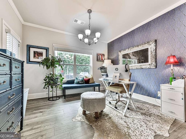 office area with an accent wall, baseboards, ornamental molding, and visible vents