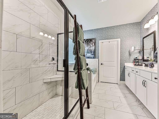 bathroom with a bathing tub, tiled shower, marble finish floor, and vanity