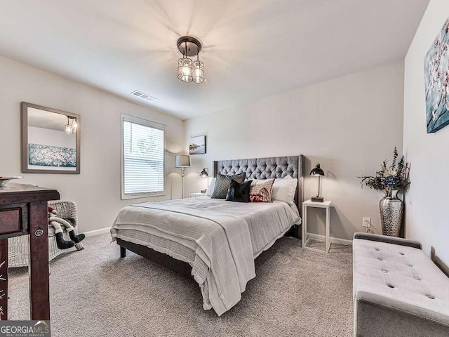 bedroom featuring baseboards, carpet, and visible vents