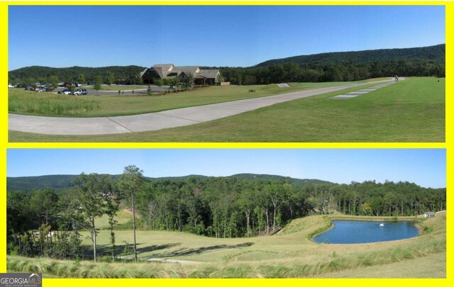 view of property's community featuring a water view, a view of trees, and a lawn