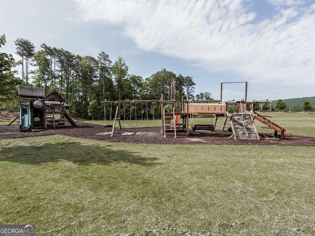 community jungle gym featuring a lawn