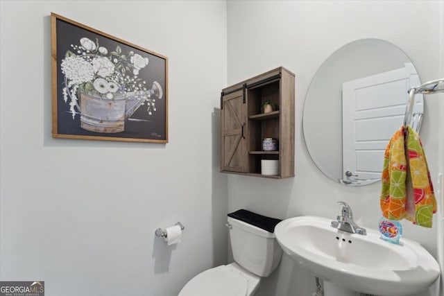 111 N Palmer St, Springfield, GA 31329 - half bathroom featuring toilet and a sink