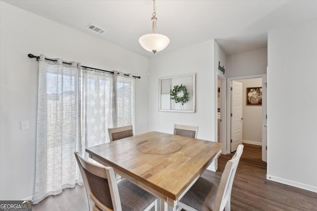 111 N Palmer St, Springfield, GA 31329 - dining area featuring wood finished floors, baseboards, and visible vents