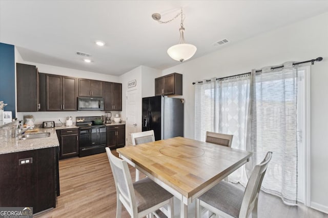 111 N Palmer St, Springfield, GA 31329 - dining room featuring light wood-style floors, recessed lighting, and visible vents