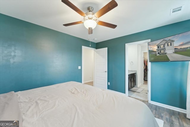 111 N Palmer St, Springfield, GA 31329 - bedroom with wood finished floors, baseboards, a ceiling fan, and visible vents