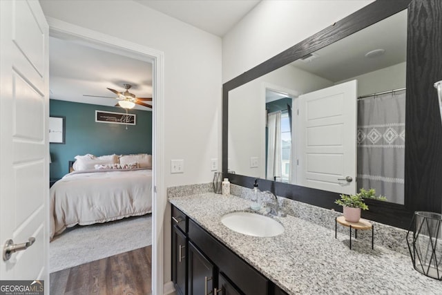 111 N Palmer St, Springfield, GA 31329 - full bathroom with connected bathroom, vanity, a ceiling fan, visible vents, and wood finished floors