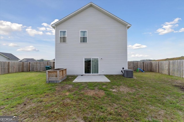111 N Palmer St, Springfield, GA 31329 - back of house featuring a yard, a patio area, a fenced backyard, and central AC