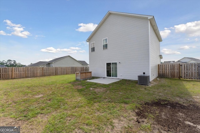 111 N Palmer St, Springfield, GA 31329 - back of property featuring central air condition unit, a yard, a fenced backyard, and a patio area