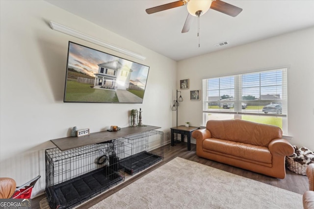 111 N Palmer St, Springfield, GA 31329 - living area featuring wood finished floors, ceiling fan, and visible vents