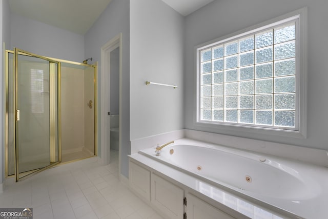 bathroom with tile patterned floors, a stall shower, toilet, and a tub with jets