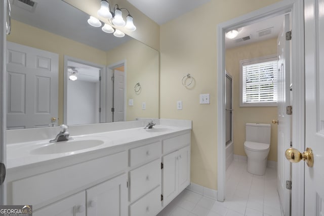 full bathroom with toilet, a sink, tile patterned floors, and visible vents