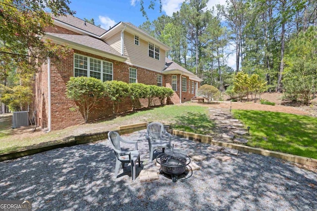 birds eye view of property with a forest view